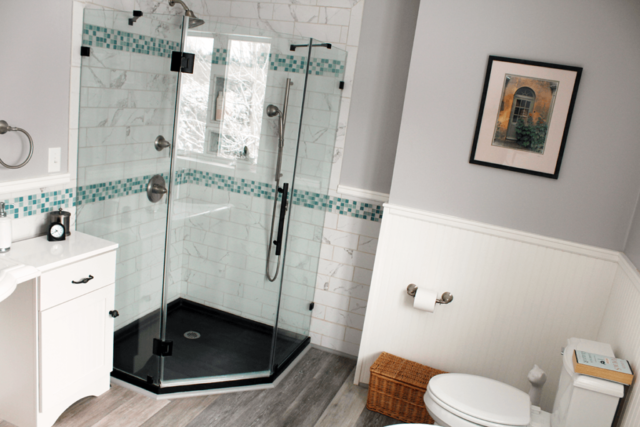 Image of corner shower stall in bathroom remodel by Free Range Builders