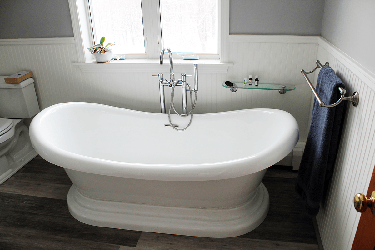 Image of tub and window in a bathroom remodel by Free Range Builders