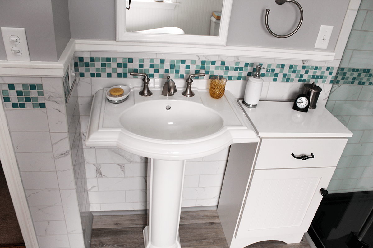 Image of pedestal sink in bathroom remodel by Free Range Builders